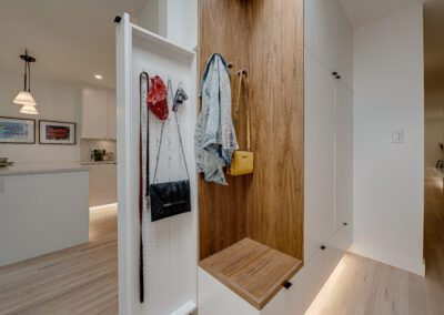 custom cabinets entrance mudroom white sliding panel