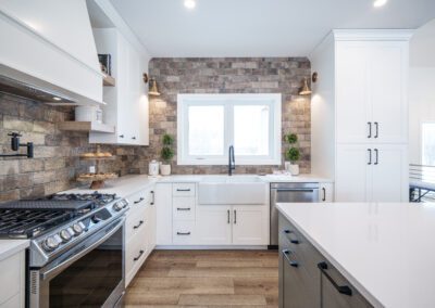 Simple white cabinets, Chelsey Grey Island with White Oak Accents at 23 Applewood Court